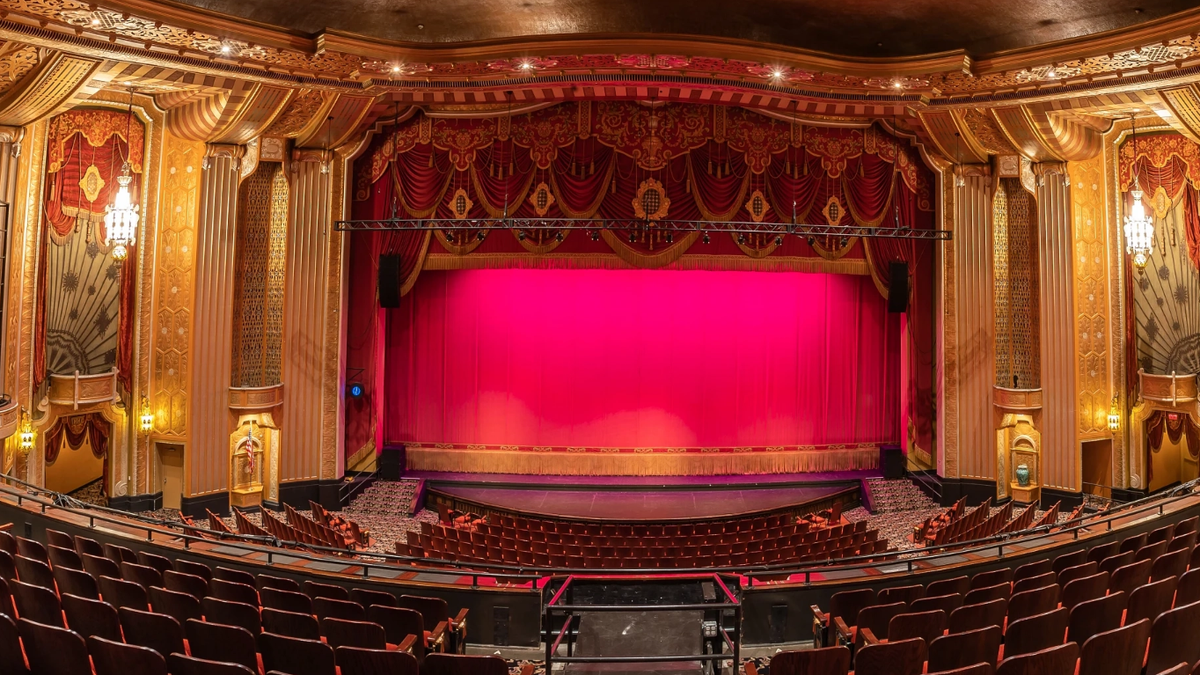 Warner Theatre, shown alit for an upcoming performance, modernized the sonic experience with JBL Professional speaker system.