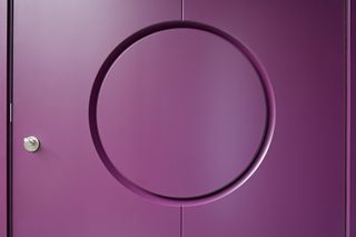 Handle concealed within contemporary style purple front door