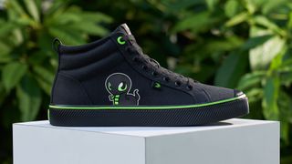 Razer Cariuma sustainable sneaker against a green leafy backdrop