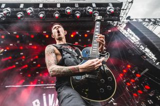 A picture of Matt Heafy performing live with Trivium