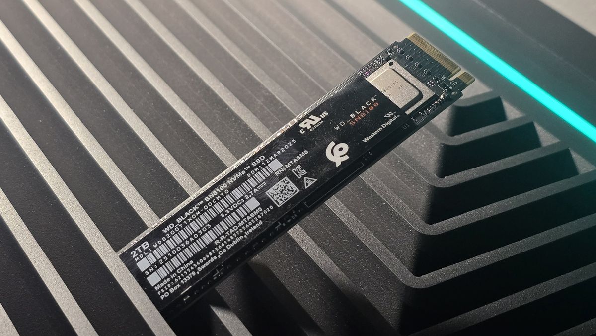 A WD Black SN8100 solid-state drive on a desk and ready to be installed.