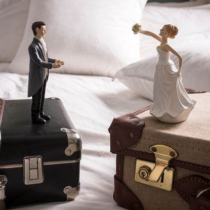 bed with cushions with dolls and box