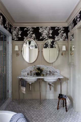 Plaster and Patina bathroom with wallpaper, marble floor and chandelier