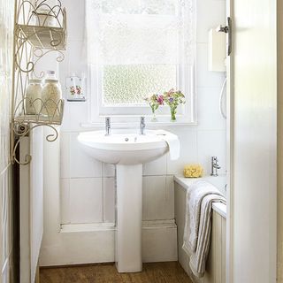 white bathroom with brown floor