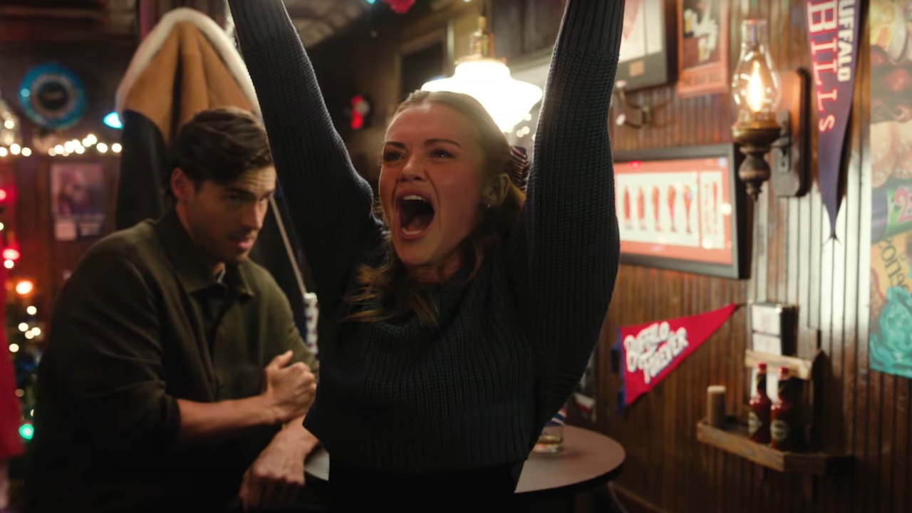 Holland Roden cheers in Holiday Touchdown: A Bills Love Story.