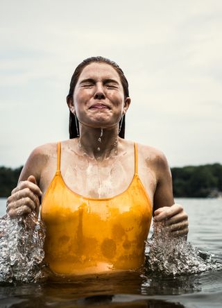 Woman smiling after wild swimming