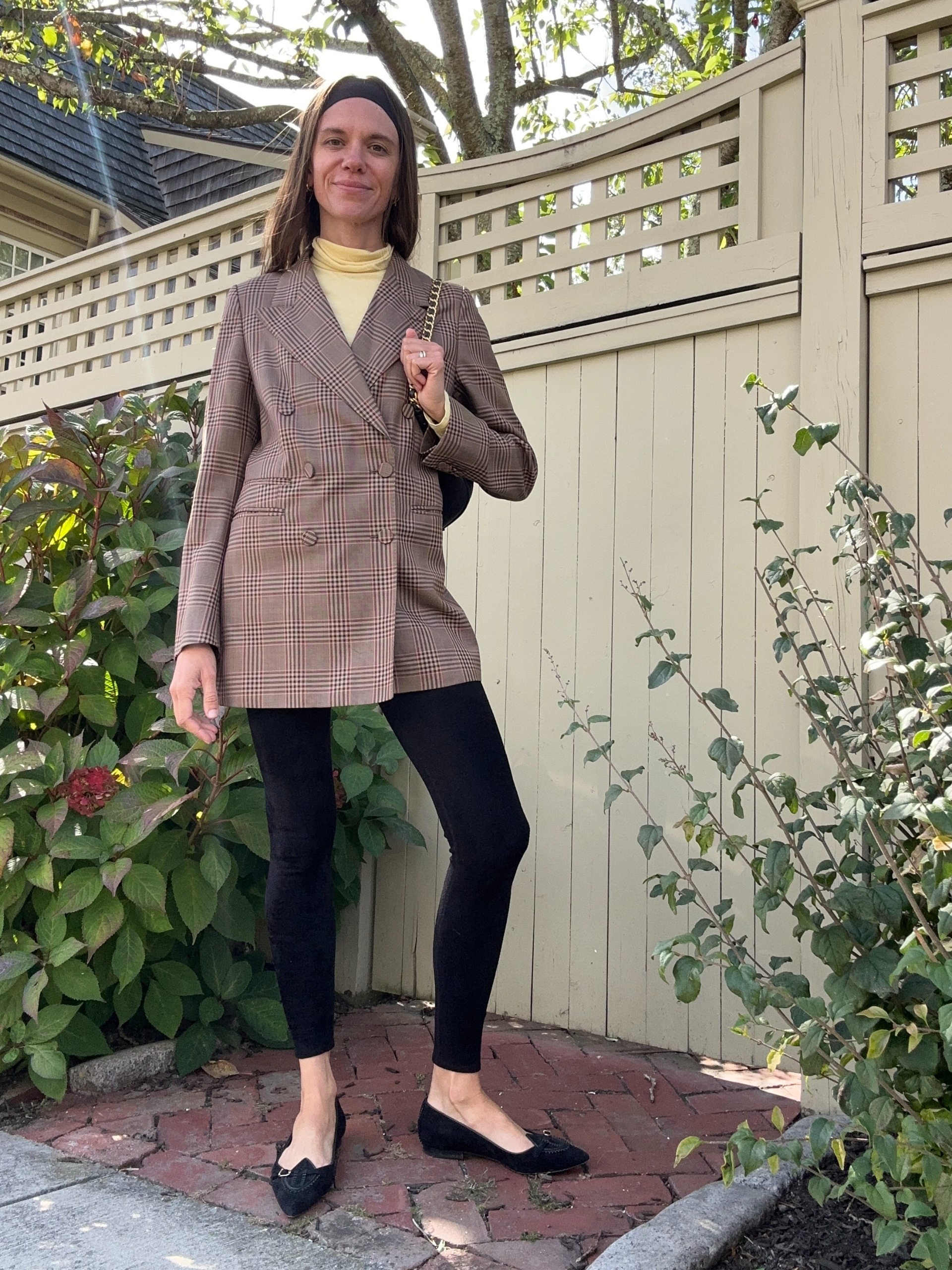 Julia Gall styles a longline blazer with black leggings and black flats