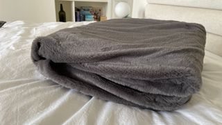 Slumberdown Elegantly Warm Heated Blanket folded on the bed