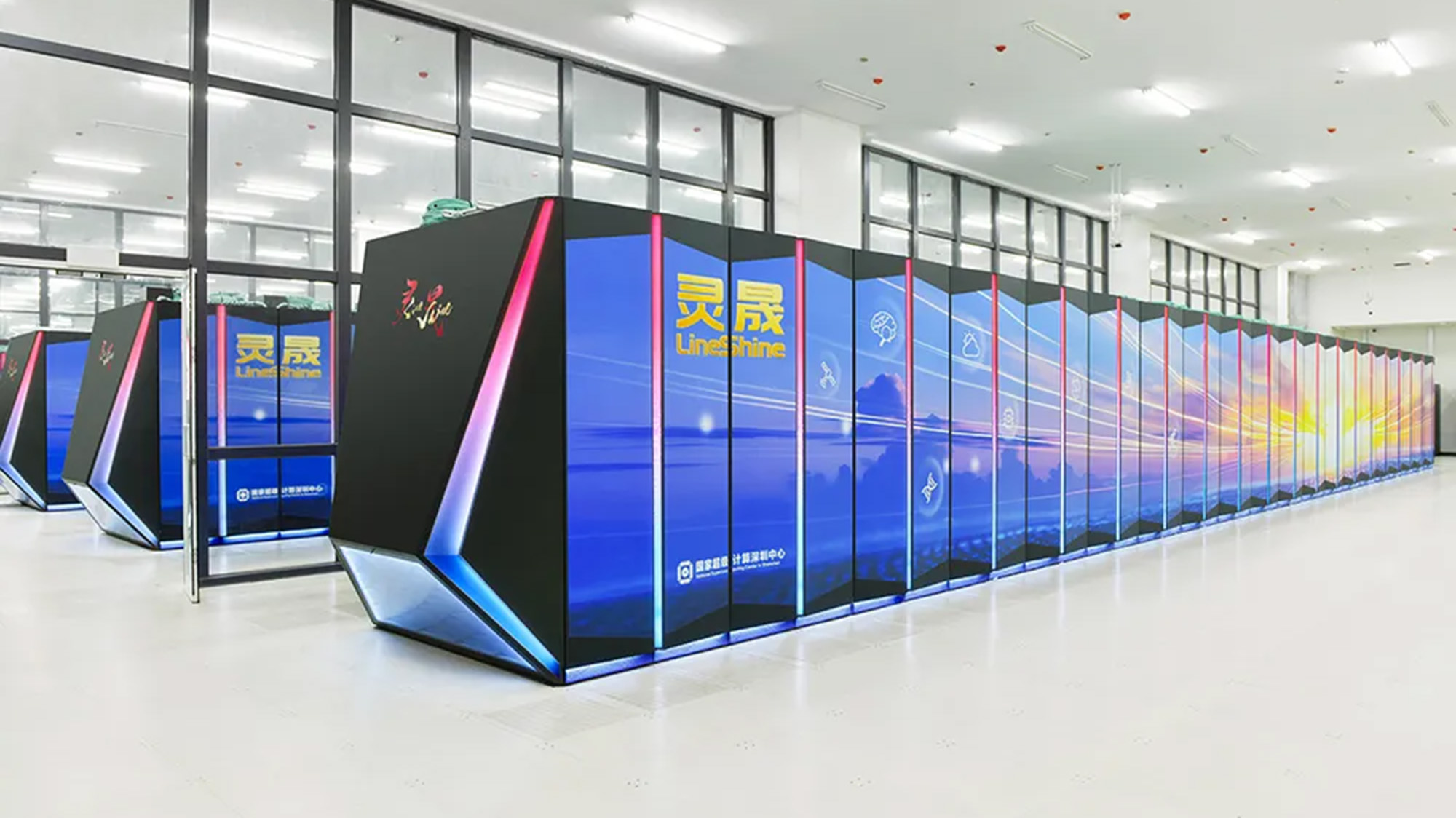 A series of blue towers in a white room with windows