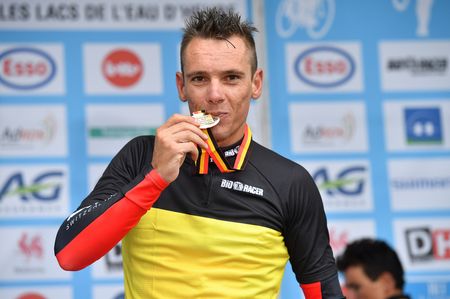 Philippe Gilbert takes a bite out his gold medal