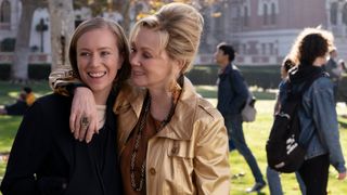 Hannah Einbinderer and Jean Smart as ava and deborah walking through a college campus in 'Hacks' season 3