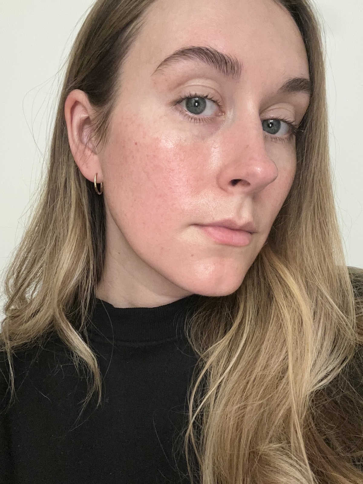 Beauty editor Kaitlyn McLintock after applying Rhode Glazing Fluid.