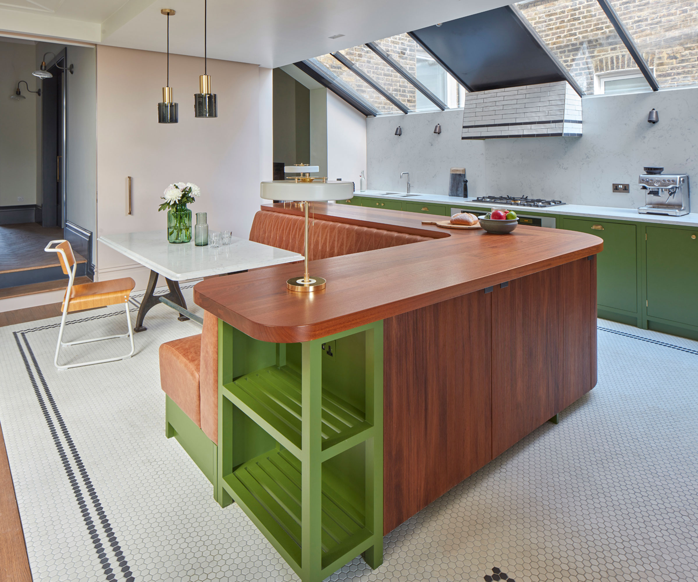 green and wooden kitchen with banquette seating