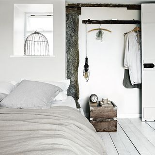 bedroom with white interiors and white bed