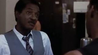 Gil Hill wearing a vest and tie and looking annoyed in Beverly Hills Cop