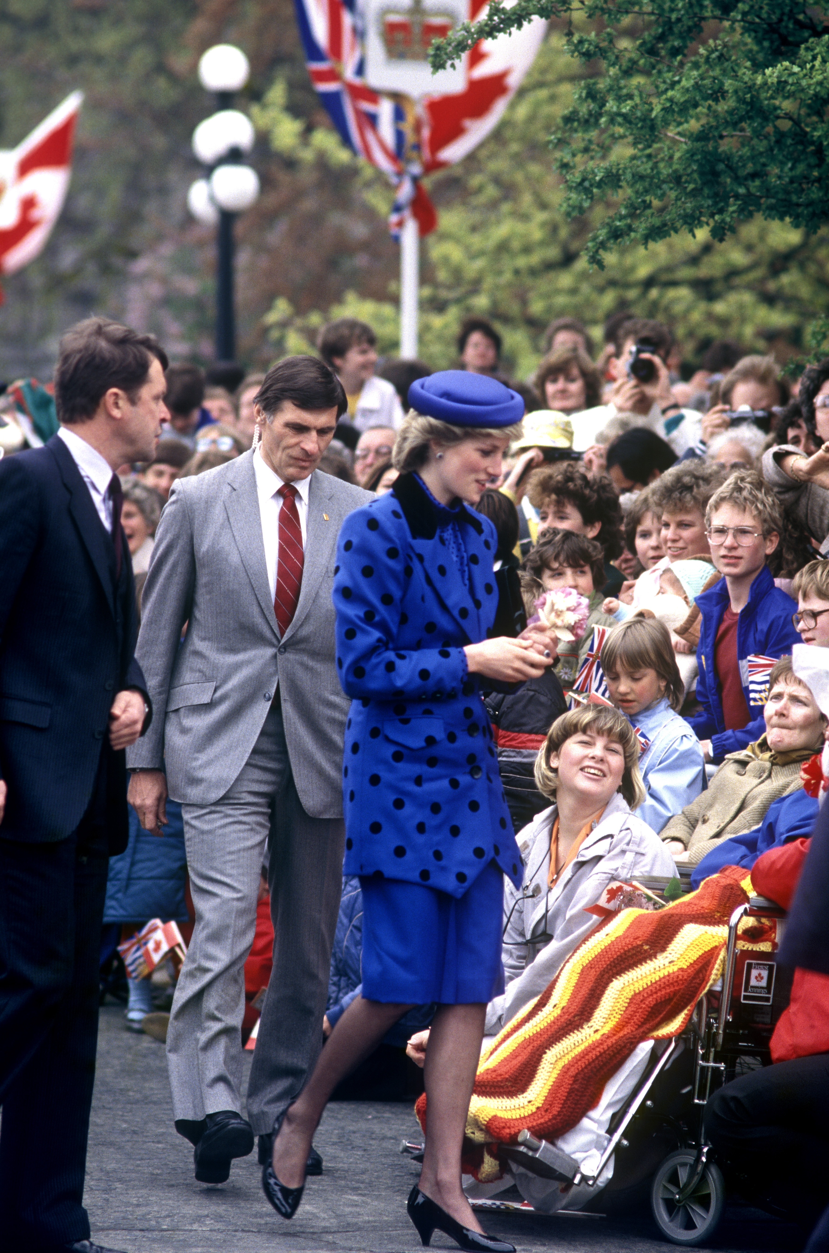 Princess Diana in a blue blazer and skirt