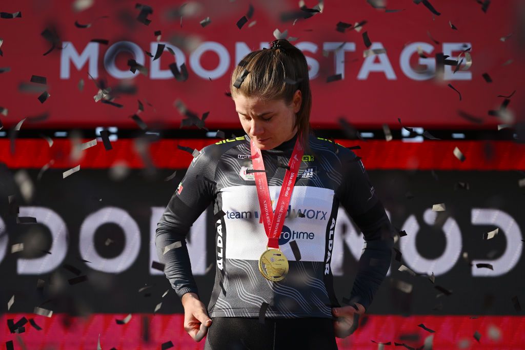 MADINAT ZAYED UNITED ARAB EMIRATES FEBRUARY 09 Lotte Kopecky of Belgium and Team SD WorxProtime celebrates at podium as Black Intermediate Sprint jersey winner during the 2nd UAE Tour 2024 Stage 2 a 113km stage Al Mirfa Bab Al Nojoum to Madinat Zayed UCIWWT on February 09 2024 in Madinat Zayed United Arab Emirates Photo by Dario BelingheriGetty Images