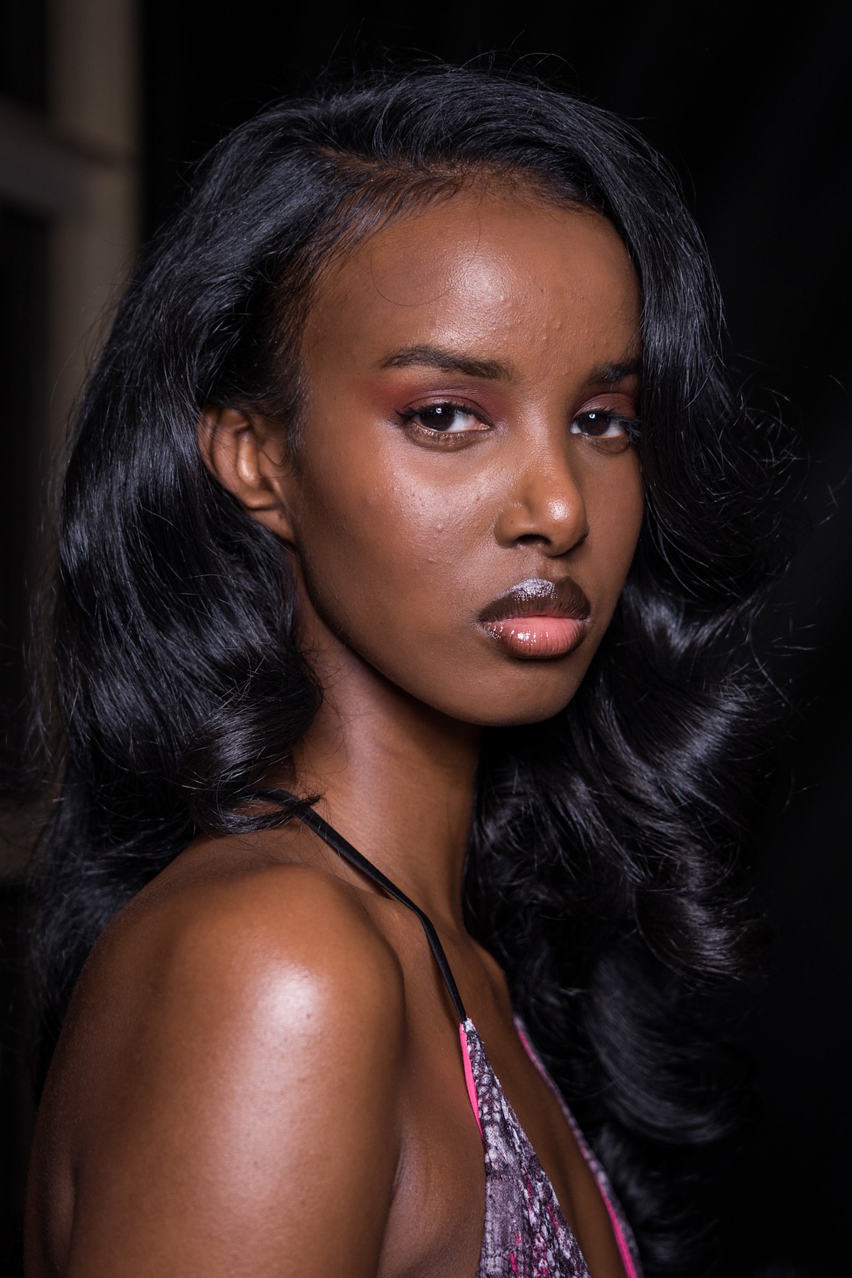 A model showing off a wavy wedding hairstyle.