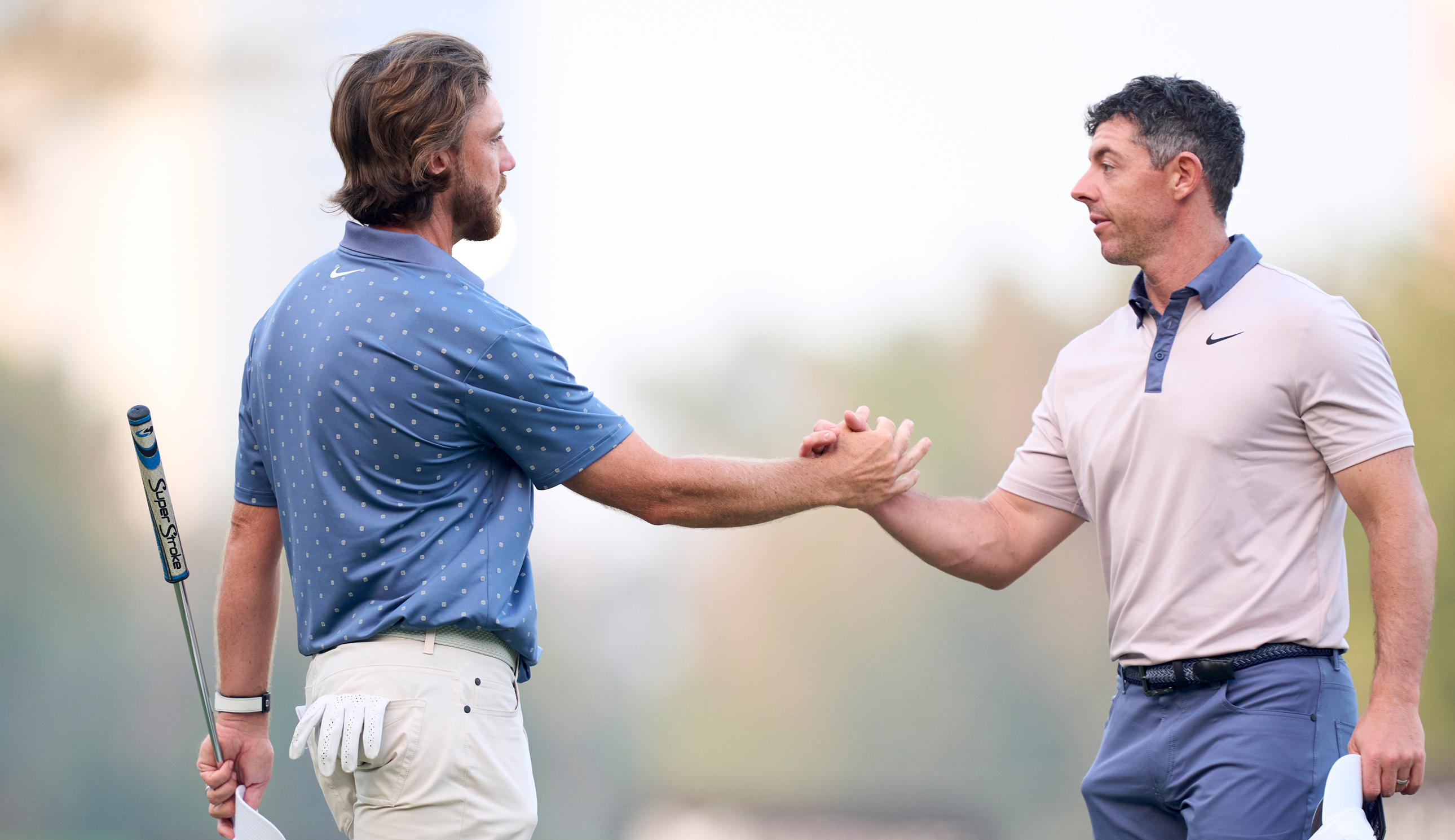 Tommy Fleetwood and Rory McIlroy shake hands