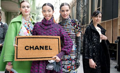 Models holding Chanel matt at Chanel A/W 2014