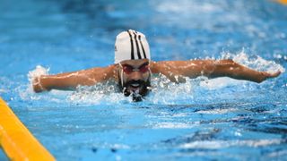 Man swimming at the Paralympics Games