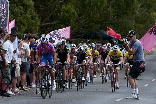 Matt Lloyd leads a pack up Mt.Buninyong as a punter gets into position to get his picture.
