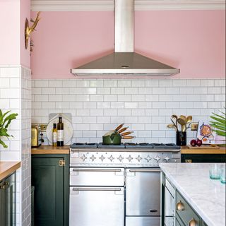 White and pink kitchen with stainless steel appliances