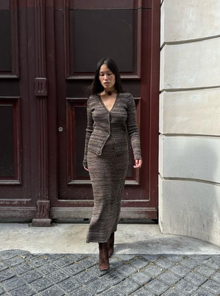 Anne-Victoire Lefevre wears a knitted co ord and suede ankle boots