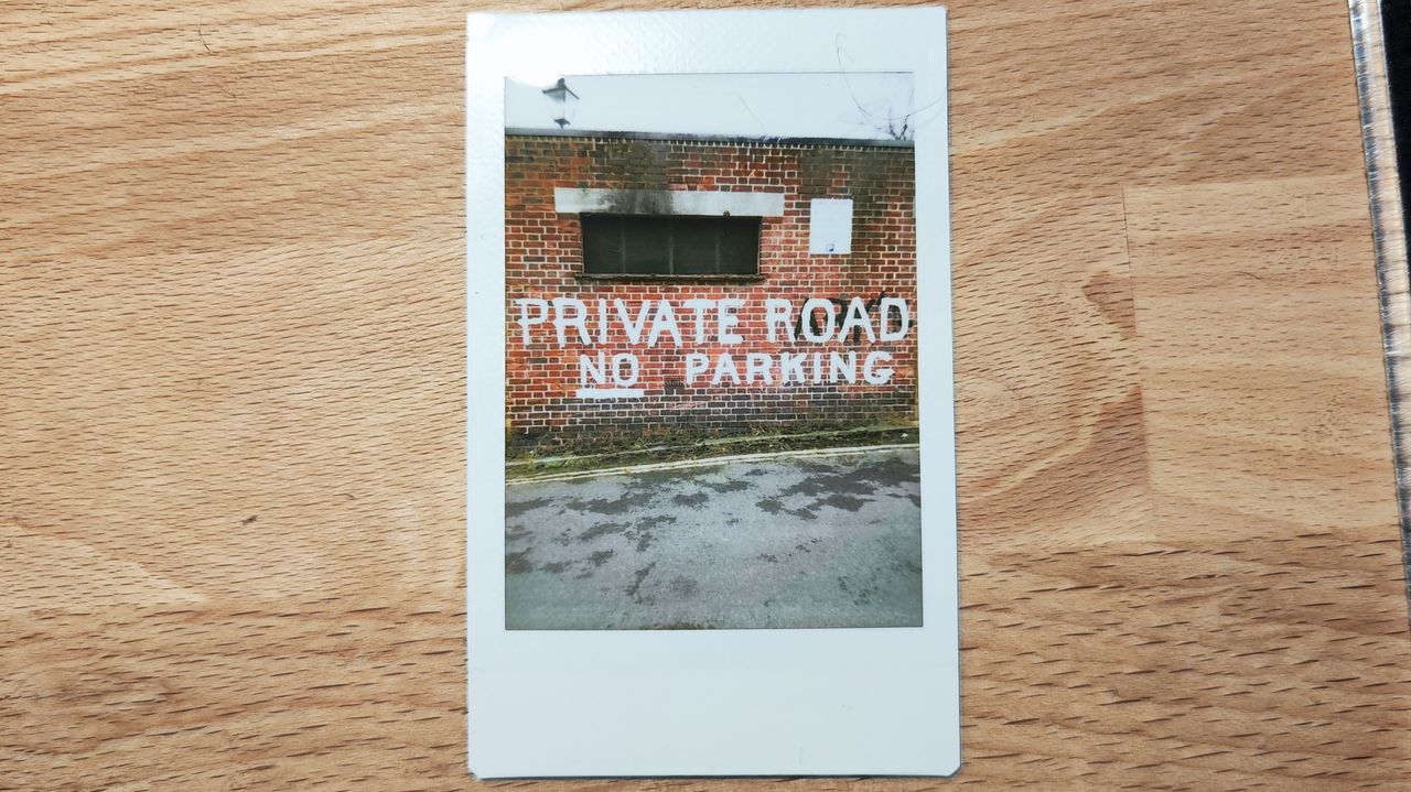 Instant photos on a wooden table