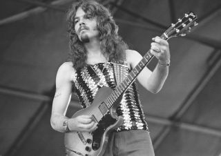 Tom Johnston performs onstage with the Doobie Brothers in 1974