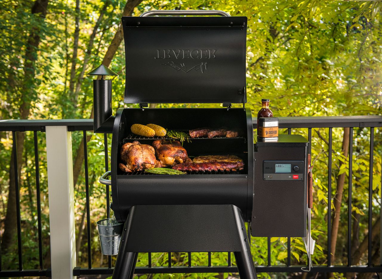 smart barbecues large barbecue with open lid filled with meat, chicken, ribs