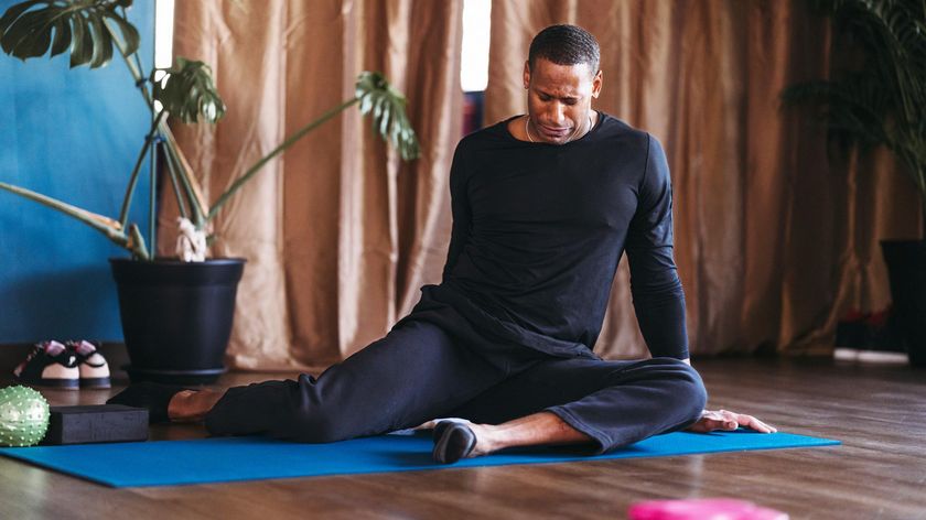 a man doing the 90/90 stretch