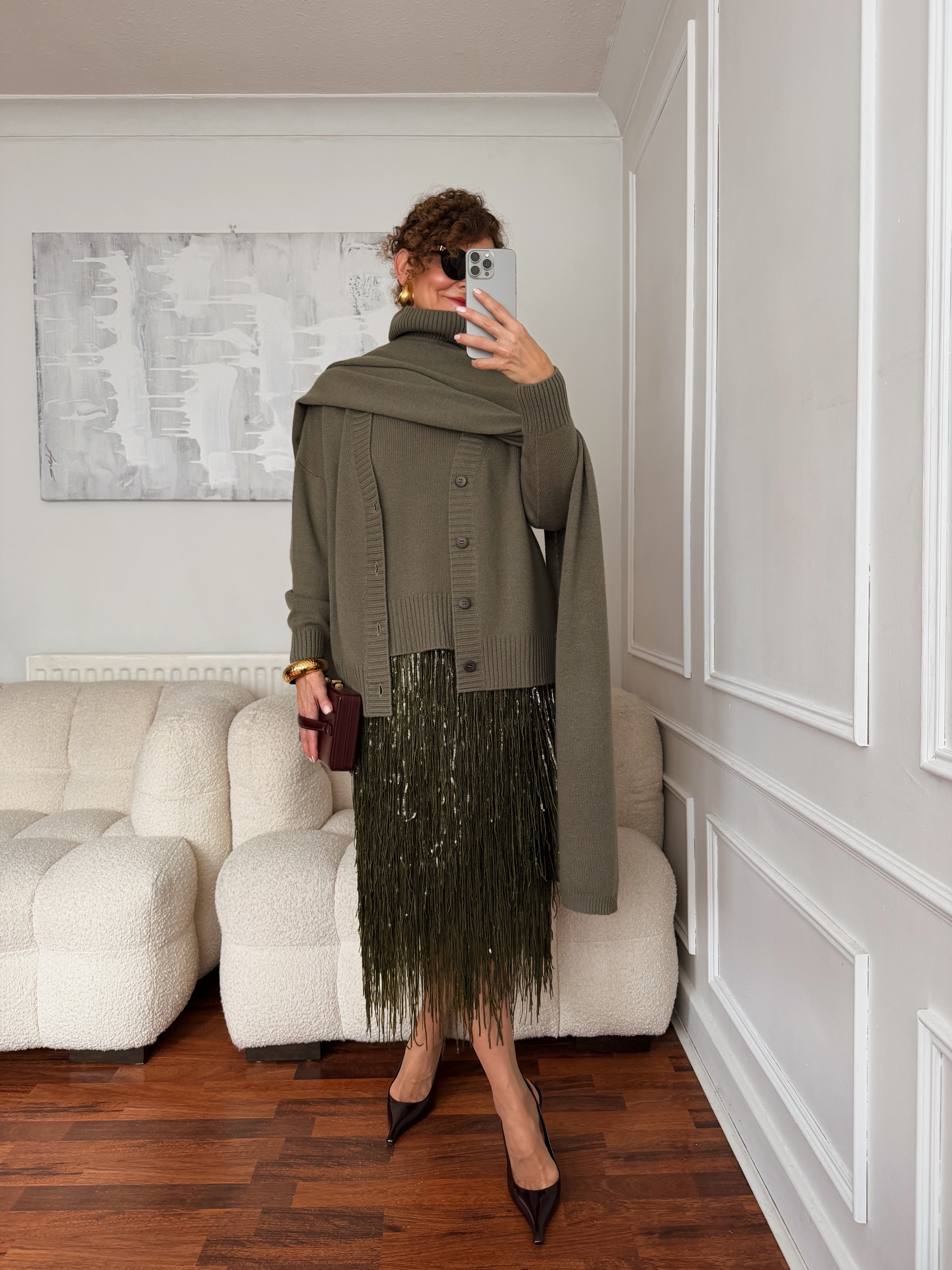 Renia Jazdzyk wearing a scarf sweater