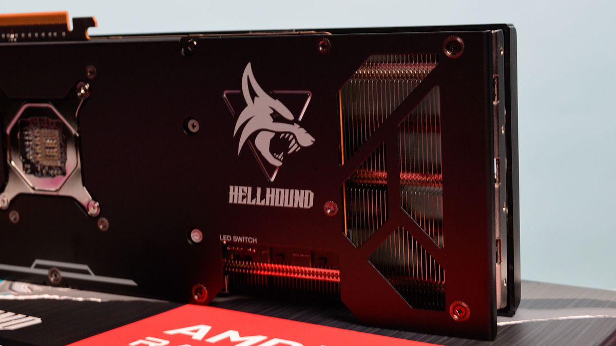 An AMD Radeon RX 7900 GRE from PowerColor on a desk with its retail packaging