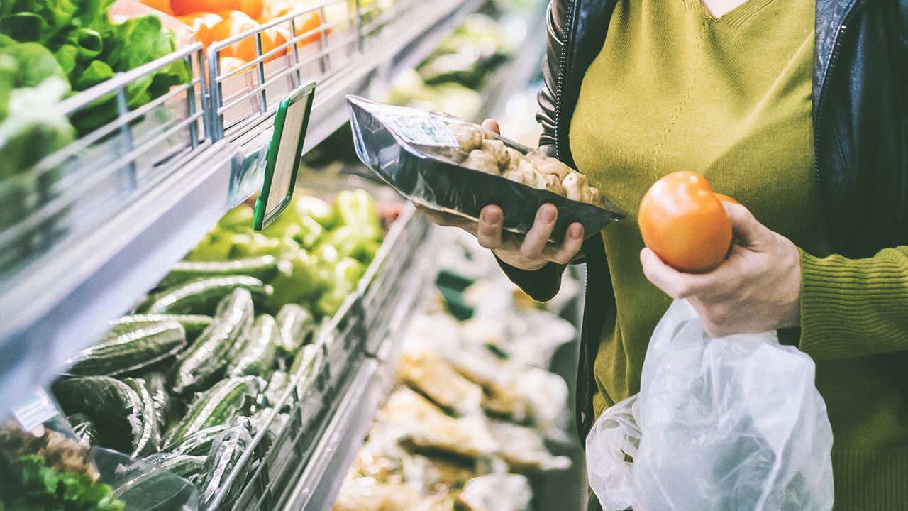 Produce being selected at a market