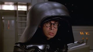 Rick Moranis making an angry face while dressed as Dark Helmet in Spaceballs. 
