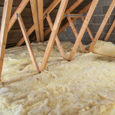 mineral wool insulation installed in a loft, with visible joists