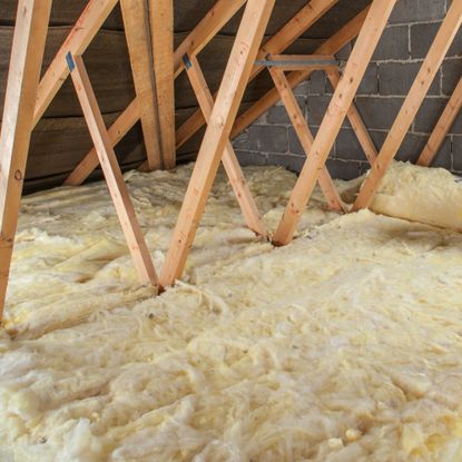 mineral wool insulation installed in a loft, with visible joists