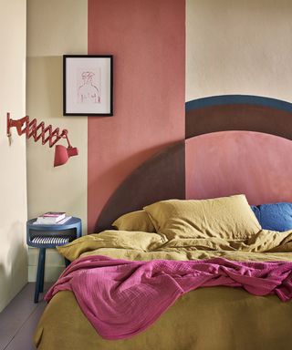 A teenage girl bedroom idea with wall paint in color blocks of sand, earthy pink and brown
