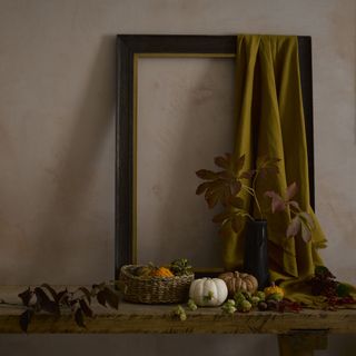 Pumpkins and autumnal decoration displayed on table top