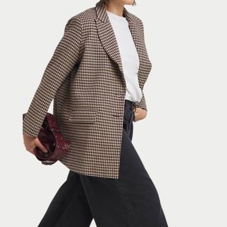 flat lay image of woman wearing checked blazer