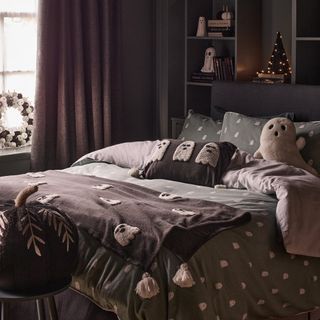 Stacey Solomon x George Home ghost-themed home decor and bedding in a bedroom