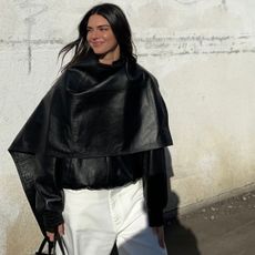 An image of Kendall Jenner wearing a cape coat from Phoebe Philo.