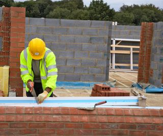 building cutting on brick wall