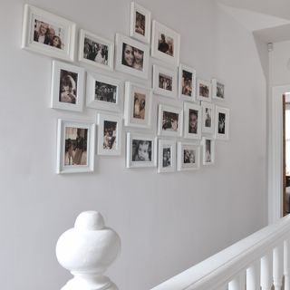 white hallway with family photos