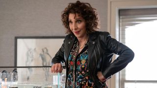 Andrea Martin standing on a stool looking down in Only Murders in the Building.