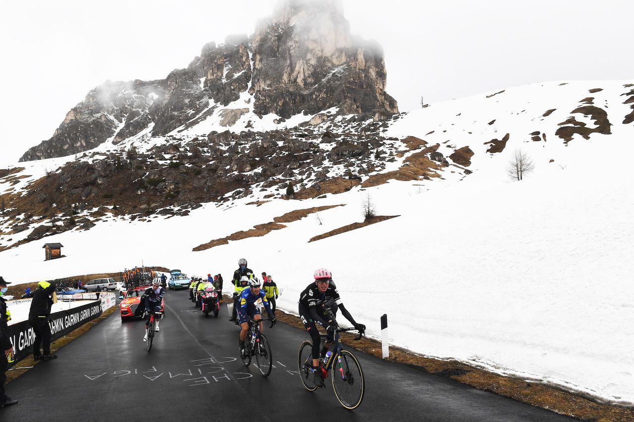 Hugh Carthy, João Almeida and Giulio Ciccone battling up the snow covered Passo Giau on stage 16 of the Giro d&#039;Italia 2021