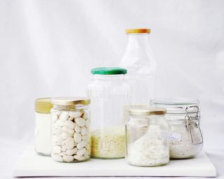 clear bottles and jars showcasing different food contents