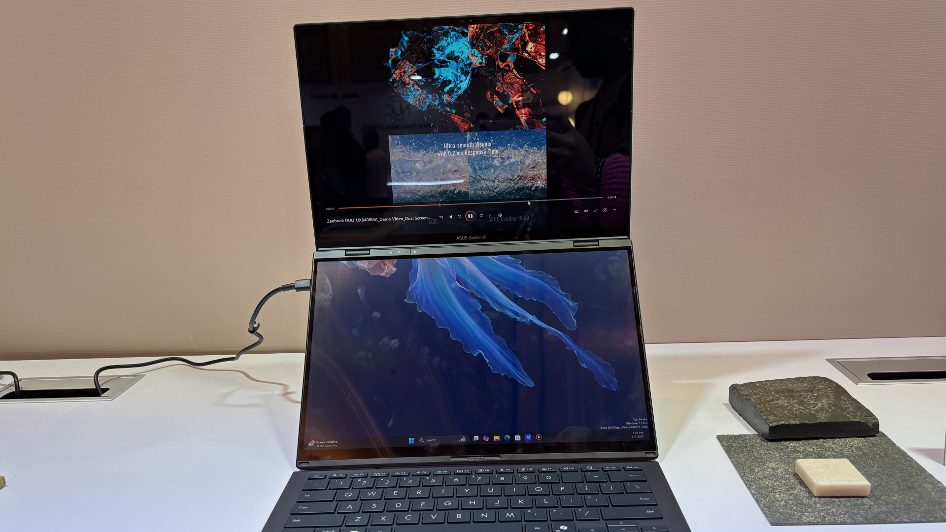 Asus Zenbook Duo (2025) dual-screen laptop on a table at CES 2025