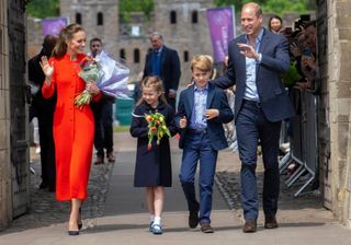 Kate Middleton wears red coat alongside the rest of the royal family at The Duke And Duchess Of Cambridge Visit Wales in 2022